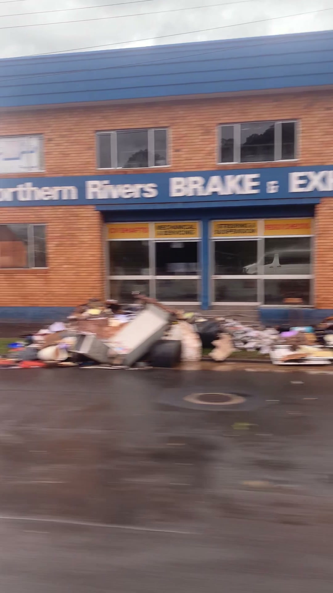 Flood-damaged belongings piled outside Northern Rivers businesses, Lismore 2022